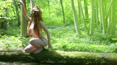 Beautiful Nude Model as a Naked Fairy in the Forest