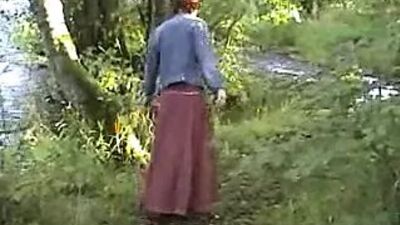 Mature exhibitionist wife plays with herself by river